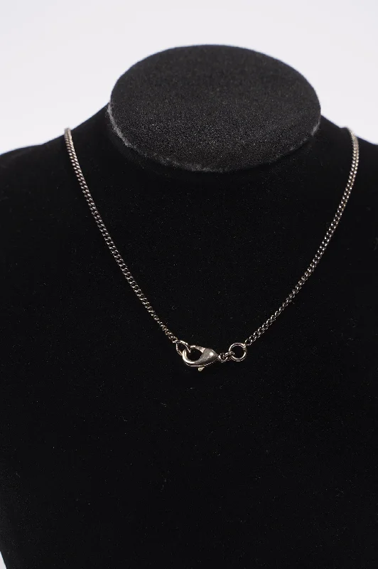 Shop Dazzling Jewelry At The Best Prices Chanel Pearl Logo Necklace Silver / Black Base Metal Shop Dazzling Jewelry At The Best Prices Chanel Pearl Logo Necklace Silver / Black Base Metal
