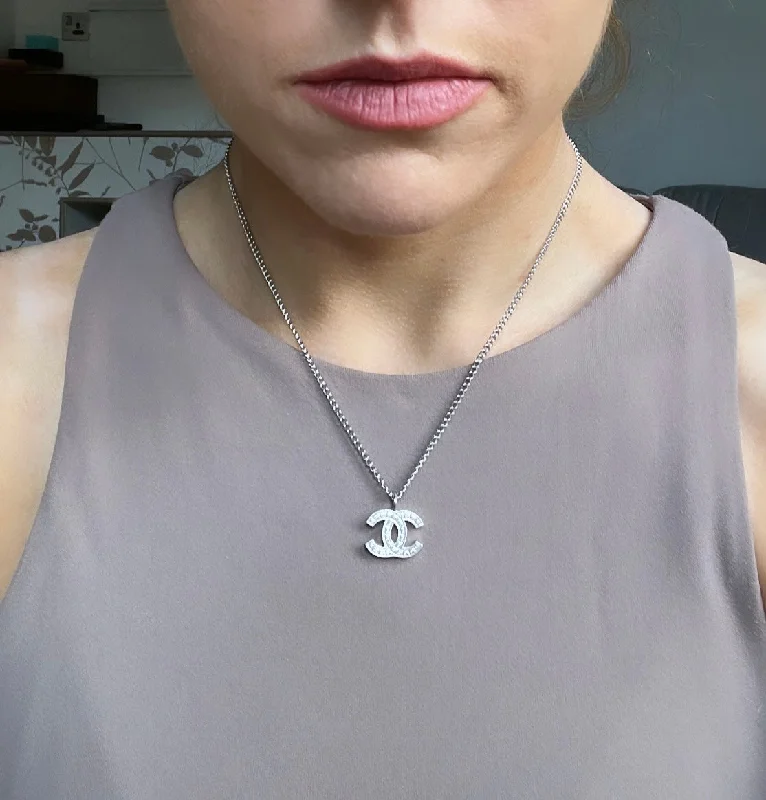 Elegant Jewelry, Exclusive Prices – Shop Now Chanel Silver Toned Embossed CC Pendant Necklace Elegant Jewelry, Exclusive Prices – Shop Now Chanel Silver Toned Embossed CC Pendant Necklace