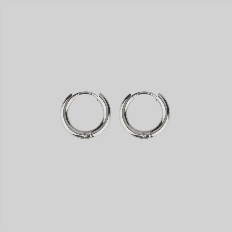 Upgrade Your Collection With Our Limited-Time Jewelry Sale VITA. Hinge Huggie Hoop Earrings - Silver Upgrade Your Collection With Our Limited-Time Jewelry Sale VITA. Hinge Huggie Hoop Earrings - Silver